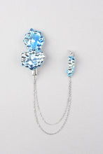 Bryon hair clip with his blue earring