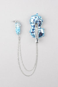Bryon hair clip with his blue earring
